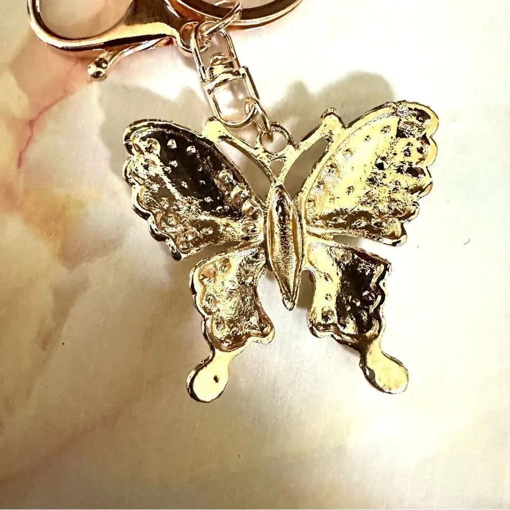 Gold tone butterfly rhinestone hang tag/keychain